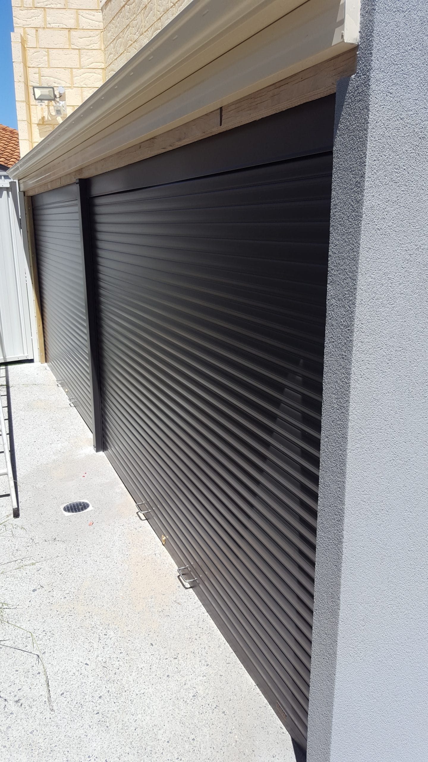 Spring driven roller shutters